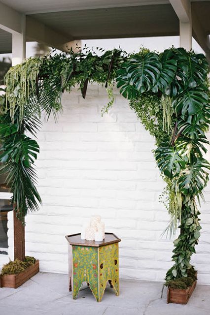 Tropical leaf wedding ceremony archway