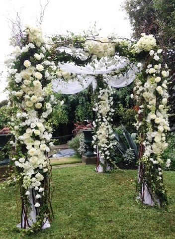 Seasonal-white-floral-and-foliage-arch-way-divine-events
