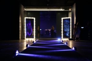 Blue lit entrance to corporate event