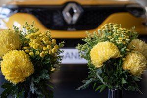 Yellow florals with yellow car in background